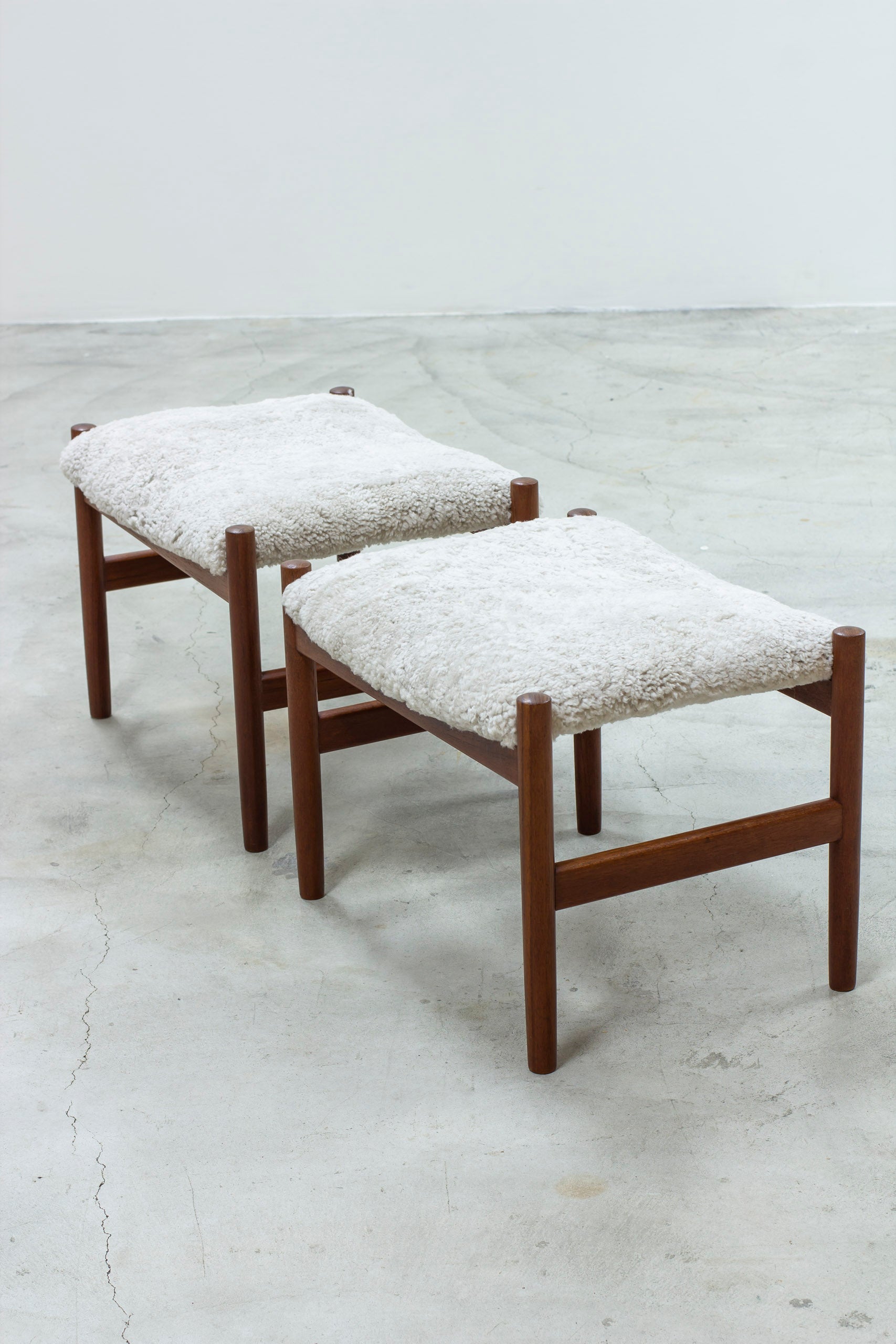 Pair of stools with sheepskin by Hugo Frandsen